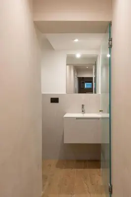 a white bedroom with a bed and a window at Vittorio Emanuele Suites&Apartments in Palermo