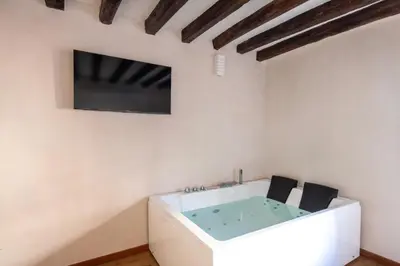 a bathroom with a sink and a mirror at Vittorio Emanuele Suites&Apartments in Palermo