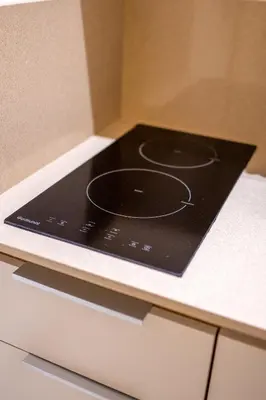 a black stove top on top of a counter at Lo Storico Apartment in Palermo