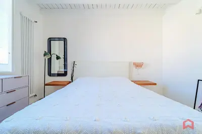 a large white bed in a room with a mirror at Incantevole Appartamento nel cuore di Palermo in Palermo