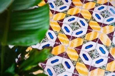 a close up of a mosaic tile on a wall at Elegante palazzo storico con splendida vista mare in Castellammare del Golfo
