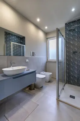 a bathroom with two sinks and two toilets at Case libertà in Palermo