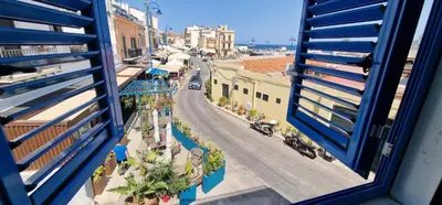 a view of a city street from a window at Casa Elisa in Palermo