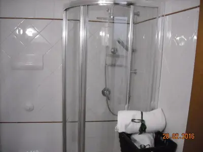 a bathroom with a shower with a glass door at Marku's House in Palermo