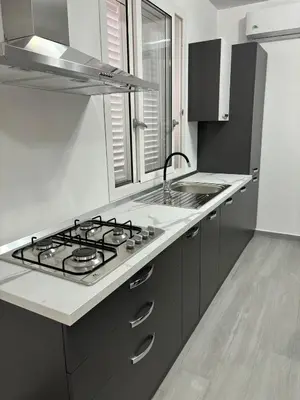 a kitchen with a stove and a sink at BALISTRERI HOUSe in Trabia