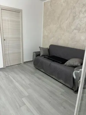 a bedroom with a bed with a laptop on it at BALISTRERI HOUSe in Trabia
