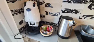 a kitchen counter with a mixer and a basket at Onyx Home in Palermo