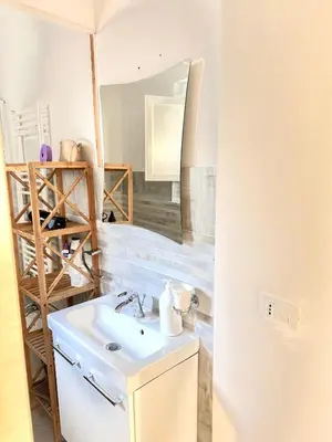 a bathroom with a sink and a mirror at Bandiera's House in Palermo