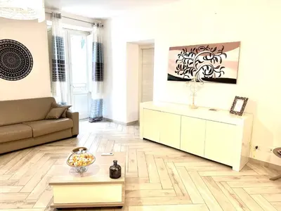 a living room with a couch and a table at Bandiera's House in Palermo