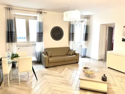 a living room with a couch and a table at Bandiera's House in Palermo