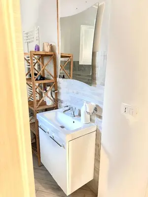 a bathroom with a sink and a mirror at Bandiera's House in Palermo