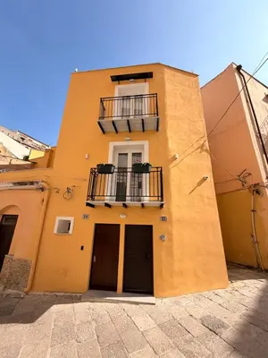 a bathroom with a toilet and a sink and a shower at Dimora Santa Spina - La Corte in Palermo