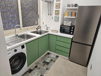 a kitchen with a sink and a washing machine at Court Holiday - La casa del Giudice in Palermo