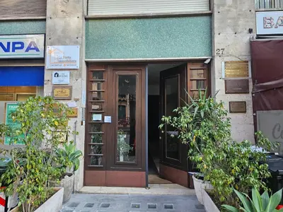 an entrance to a building with plants in front of it at Court Holiday - La casa del Giudice in Palermo