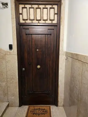 a wooden door with a welcome sign in front of it at Court Holiday - La casa del Giudice in Palermo
