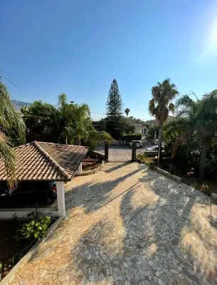 an archway leading to a driveway in a house at Villa Seaside in Cinisi