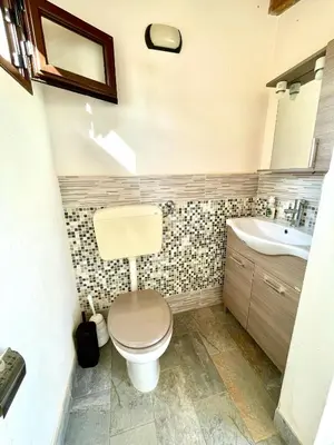 a bathroom with a sink and a toilet and a shower at Villa Seaside in Cinisi