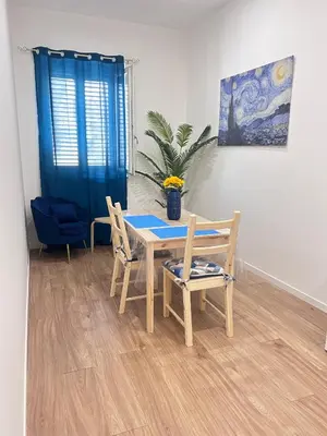 a dining room with a table and two chairs at Dimora dell'Olivella 2 in Palermo