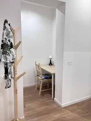 a room with a staircase and a table with a chair at Dimora dell'Olivella 2 in Palermo