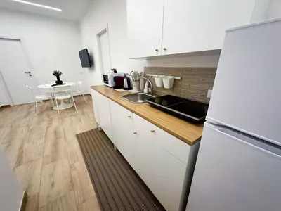 a living room with a table with a plant on it at Daimana holiday apartament in Palermo