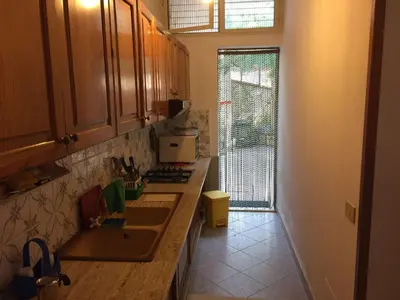 a kitchen with a sink and a counter top at Apartment Villa Gina in Trappeto by Interhome in Trappeto