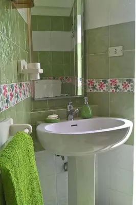 a bathroom with a white sink and a mirror at Holiday Home Villa Aliotis 200m vom Meer entfernt by Interhome in Alcamo Marina