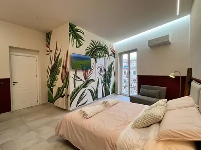 a table with a blender and a box of energy bars at Palermo City Garden Lux Suites in Palermo