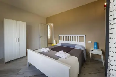 a bedroom with a bed with two towels on it at APT Marta in Villa Rosaria Vista Mare Zingaro in Scopello
