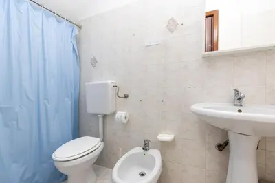 a bathroom with a toilet and a sink at Visitsicilia Saramia in Balestrate