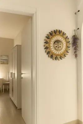 a clock on the wall of a room at Cattedrale stay in Palermo