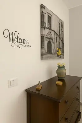 a dresser in a room with a picture on the wall at Cattedrale stay in Palermo