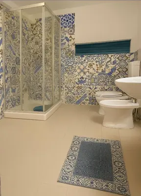 a bathroom with a shower and a toilet and a sink at Cattedrale stay in Palermo