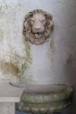 a statue of a lion on the side of a wall at Apartment Wohnung mit Wasserblick by Interhome in Castellammare del Golfo