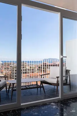 a view from the balcony of a room with sliding glass doors at Skyline Boutique Hotel in Palermo