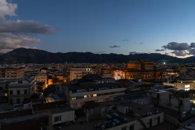 a view of a city at night at Skyline Boutique Hotel in Palermo