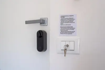 a door with a pair of scissors and a key at Ludohome in Palermo