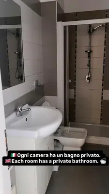 a bathroom with a sink and a toilet at Aurea Suites in Palermo