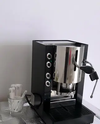 a coffee maker sitting on top of a counter at Aurea Suites in Palermo