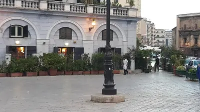 a black light pole in front of a building at Zagarellai apartment alla Kalsa Fast wi-fi in Palermo
