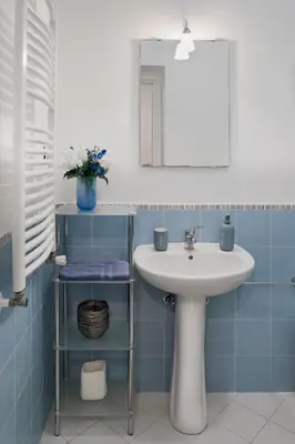 a bathroom with a sink and a mirror at Zagarellai apartment alla Kalsa Fast wi-fi in Palermo
