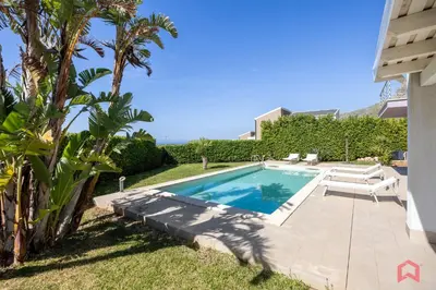 a swimming pool in the backyard of a house at Villa Privata con Piscina a Scopello in Castellammare del Golfo