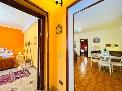 a bedroom with a bed and a table in a room at O Firrìu in Carini