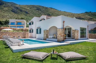 a villa with a swimming pool and a house at Villa Coraline - Castellammare in Balata di Baida