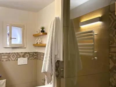a bathroom with a shower with a glass door at Casa NiMia al centro storico di Palermo in Palermo