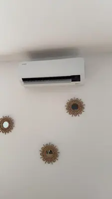 a white ceiling with two sun stickers on it at Casa Lo Bianco in Terrasini