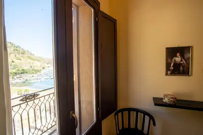 a door to a room with a view of a balcony at GaR07 in Castellammare del Golfo