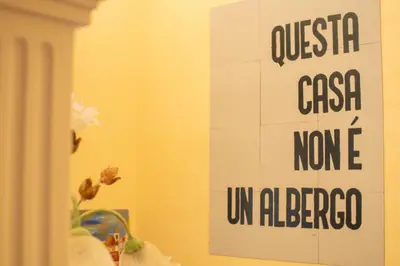 a sign on a wall in a room with a sink at GaR07 in Castellammare del Golfo