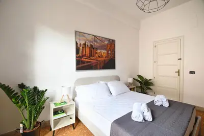 a bedroom with a bed with towels on it at La Lumia Apartment in Palermo