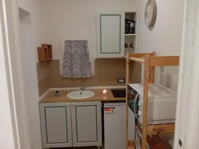 a kitchen with a sink and a cabinet at Casa Maria in Palermo