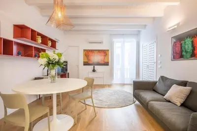 a living room with a table and a couch at Mori apartment Libertà Politeama in Palermo